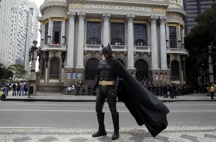 An anti-government demonstrator dressed as comic book superhero Batman poses in front of Municipal Teatre at a protest during the Brazil's Independence Day in Rio de Janeiro, September 7, 2013. The protest was a call to the government to provide better security, education, health and public services. REUTERS/Pilar Olivares (BRAZIL - Tags: CIVIL UNREST POLITICS)