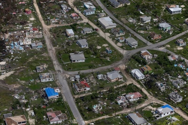 Houses are seen in ruins in Codrington on the island of Barbuda just after a month after Hurricane Irma struck the Caribbean islands of Antigua and Barbuda, October 7, 2017. Picture taken October 7, 2017. REUTERS/Shannon Stapleton - RC1BBA7B6E10