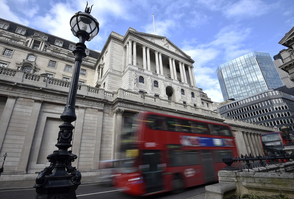 A bus passes the Bank of England in the City of London, Britain, February 14, 2017. REUTERS/Hannah McKay - RTSYMRM