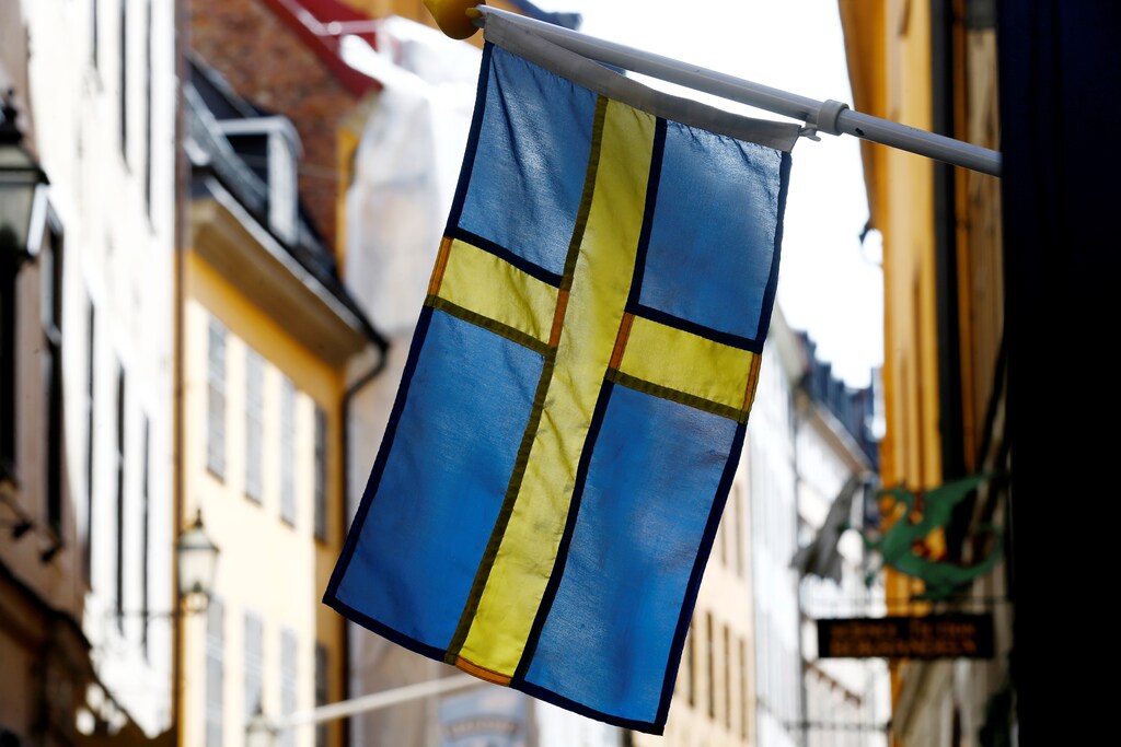 The Swedish flag is seen at Gamla Stan, the Old City of Stockholm, Sweden, May 7, 2017. REUTERS/Ints Kalnins - RC1BA4D95840