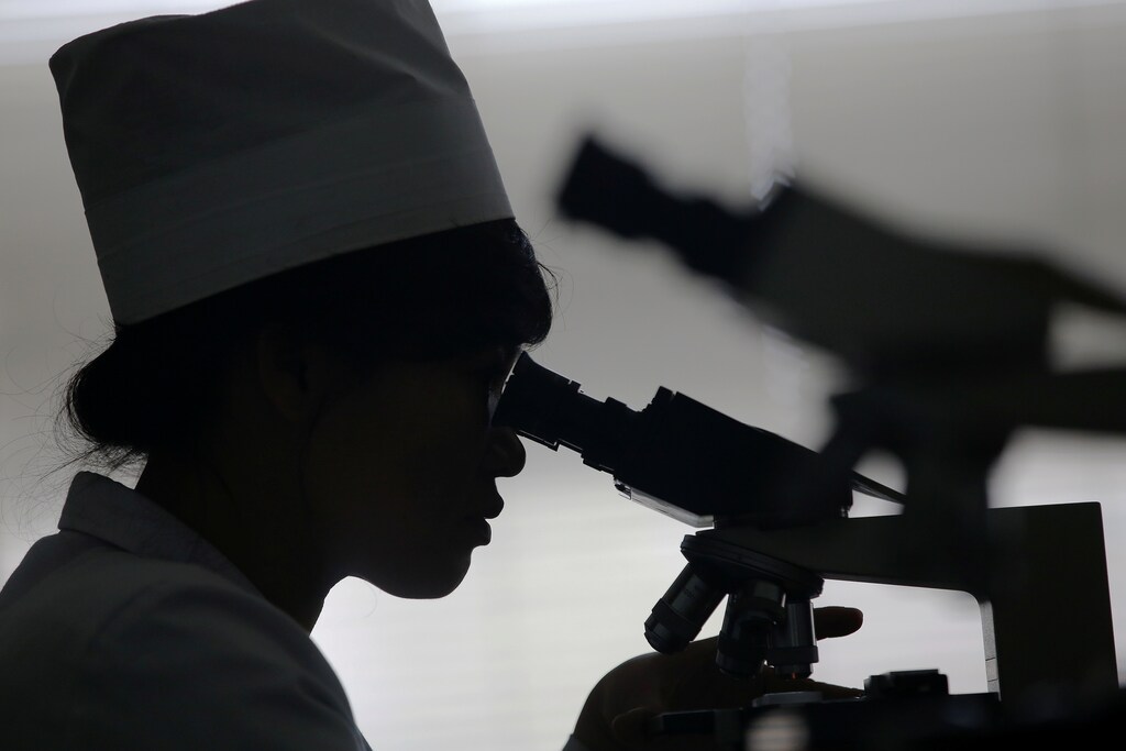 A doctor uses a microscope at the lab of the Pyongyang Maternity Hospital during a visit by foreign reporters on a government organised tour in Pyongyang, North Korea May 7, 2016. REUTERS/Damir Sagolj - RTX2D82J