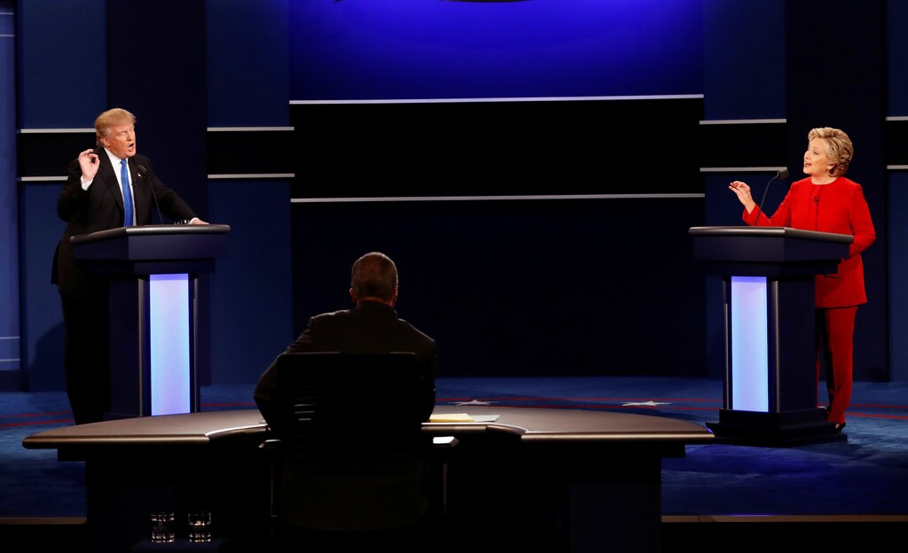 Republican U.S. presidential nominee Donald Trump and Democratic U.S. presidential nominee Hillary Clinton speak at their first presidential debate at Hofstra University in Hempstead, New York, U.S., September 26, 2016. Picture taken September 26, 2016. REUTERS/Mike Segar - RTSPO3R