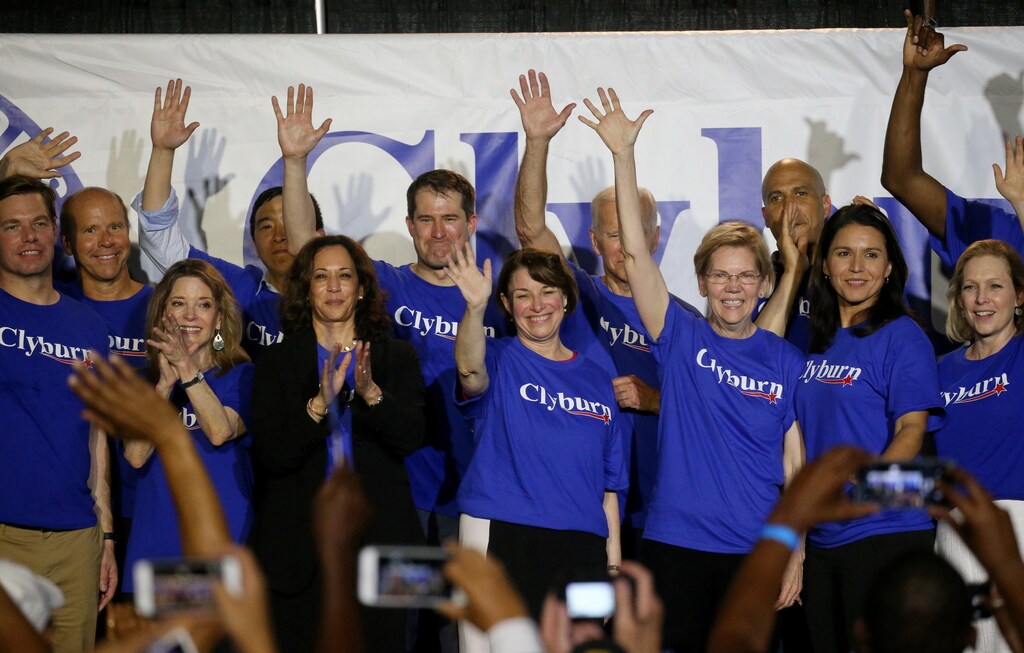 Democratic presidential candidates stand on stage together, including all of the women running, Marianne Williamson, Sen. Kamala Harris, Sen. Amy Klobuchar, Sen. Elizabeth Warren, Rep. Tulsi Gabbard, and Sen. Kirsten Gillibrand during Jim Clyburn's World Famous Fish Fry in Columbia, South Carolina, U.S., June 21, 2019. Picture taken June 21, 2019. REUTERS/Leah Millis - RC1EBC0CE190