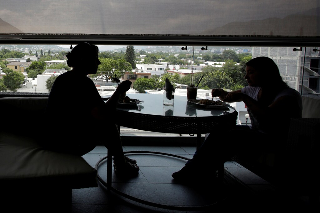 People eat breakfast at a restaurant in Monterrey city, Mexico, July 26, 2018. Picture taken July 26, 2018. REUTERS/Daniel Becerril - RC1A2D4E2340