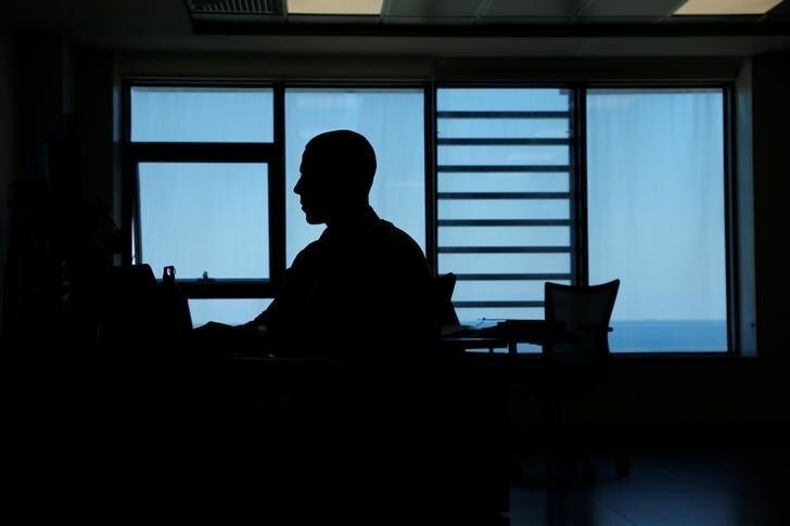 A Malta Gaming Authority employee works at his desk at the authority's headquarters in SmartCity Malta in Kalkara, Malta, June 22, 2017. Picture taken June 22, 2017. REUTERS/Darrin Zammit Lupi