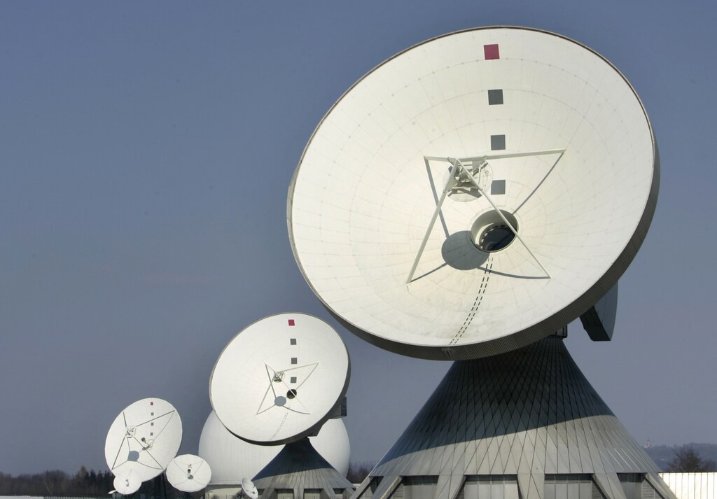 Telecommunication satellite dishes are pictured in the southern Bavarian village of Raisting, 40 kilometers (25 miles) south of Munich March 15, 2005. Germany's interior minister Otto Schily intends to set up a central data base for all internet and telephone exchanges in an effort to combat terrorism. Speaking on the sidelines of the CeBIT computer fair in Hannover, Schily said telecommunication activities should be stored for up to one year. TECOM REUTERS/Michaela Rehle MR/MAD - RP6DRNATAKAA