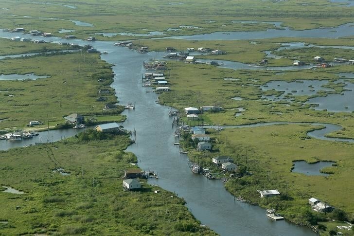 Communities are seen surrounded by water and wetlands in Plaquemines Parish, Louisiana, August 25, 2015. REUTERS/Jonathan Bachman TPX IMAGES OF THE DAY