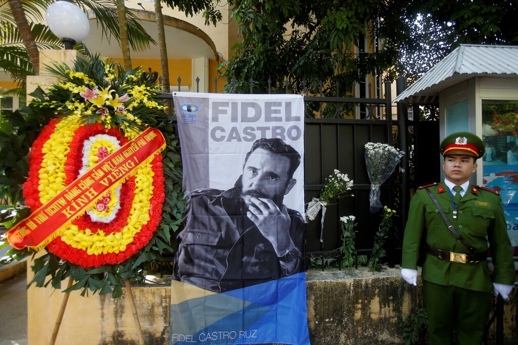 Vietnamese guard stands outside Cuban embassy while as people pay tribute to late leader Fidel Castro in Hanoi November 28, 2016. REUTERS/Kham - RTSTLQ1