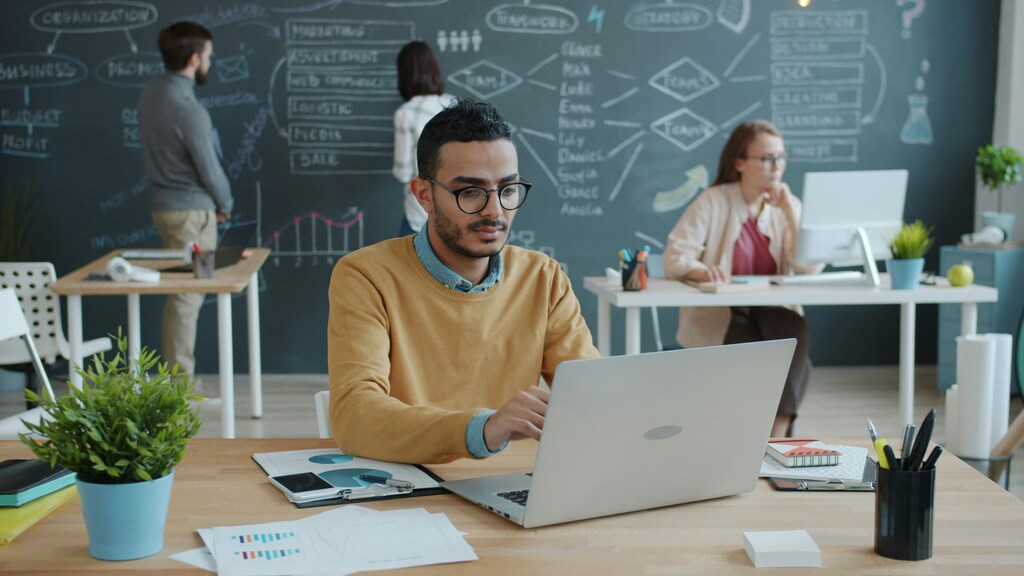 A man, laptop, smartphone, office, innovation, technology, access, digital commons.