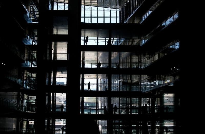 People can be seen in an office building of Spanish power company Endesa in Madrid, Spain, April 26, 2016. REUTERS/Andrea Comas/File Photo GLOBAL BUSINESS WEEK AHEAD PACKAGE - SEARCH 'BUSINESS WEEK AHEAD NOV 7' FOR ALL IMAGES - RTX2S8J7