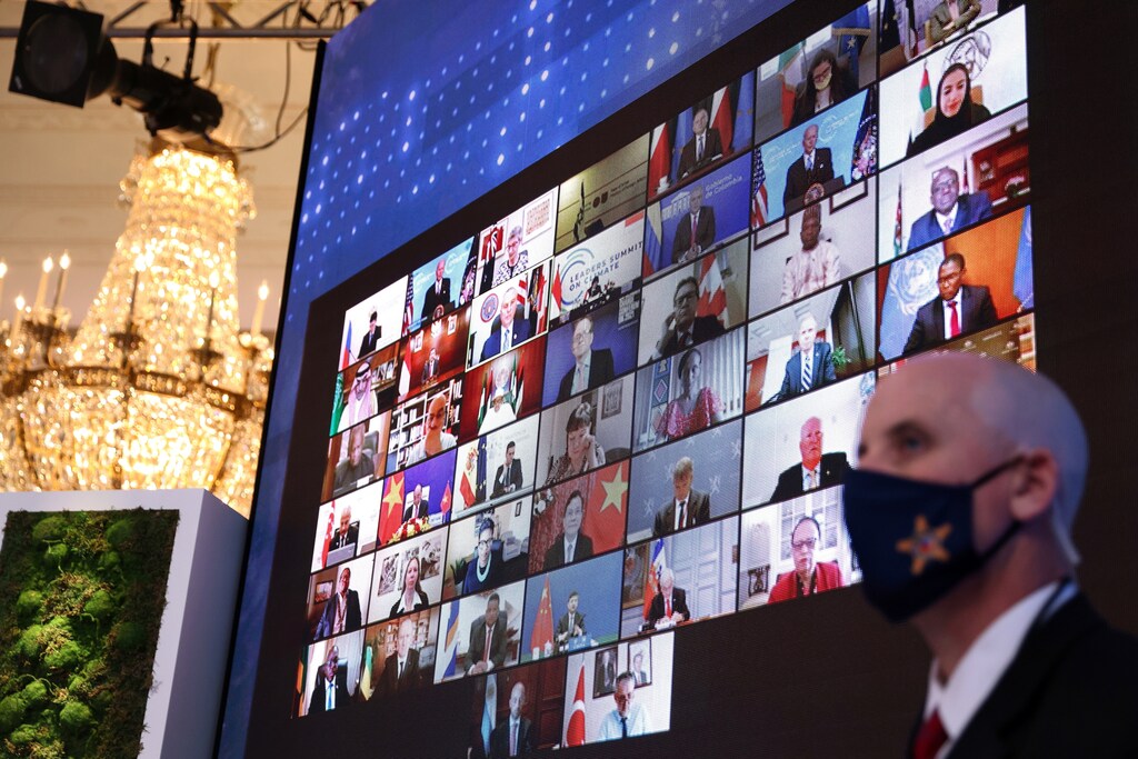 World leaders appear on a video screen during a virtual Climate Summit with world leaders in the East Room at the White House in Washington, U.S., April 23, 2021.
