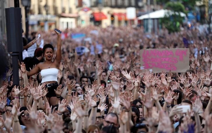 Protesters attend a demonstration against the release on bail of five men known as the "Wolf Pack" cleared of gang rape of a teenager and convicted of a lesser crime of sexual abuse in Madrid, Spain, June 22, 2018. REUTERS/Susana Vera