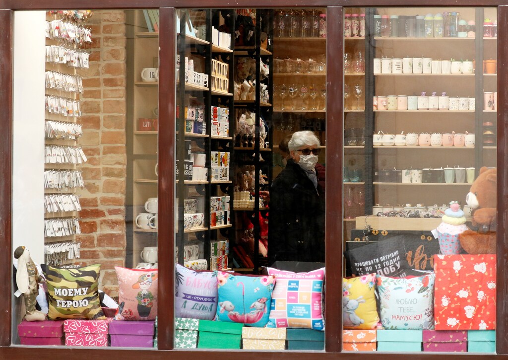 A visitor wearing a protective face mask is seen inside a souvenir store amid the ongoing coronavirus disease (COVID-19) outbreak in central Lviv, Ukraine, October 11, 2021.