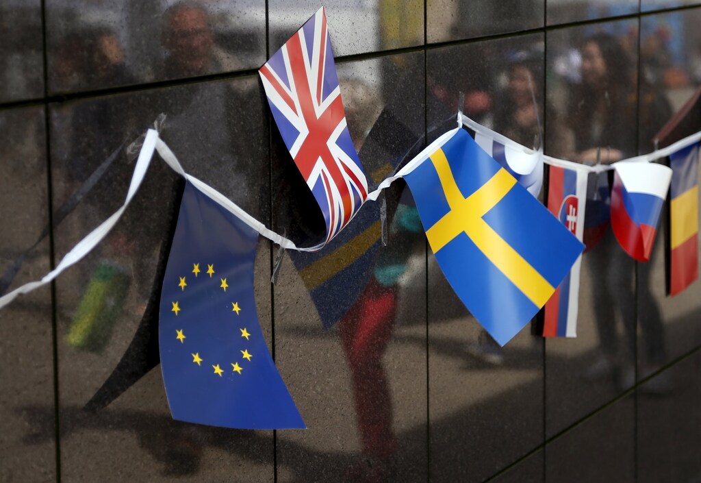 A Union Flag flutters next to a European Union (EU) flag, and other flags of EU countries on Open Doors Day of the EU institutions in Brussels, Belgium May 9, 2015.