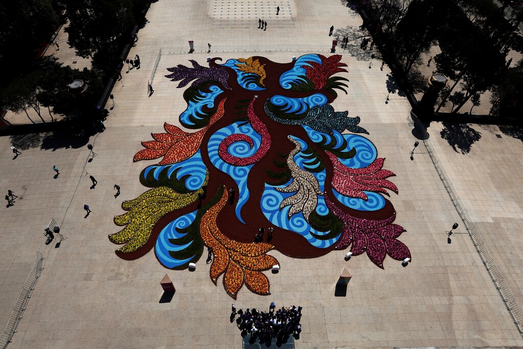 A carpet of flowers made of painted corn leaves is seen as part of the Flowers and Gardens Festival, at the Monument to the Revolution, in Mexico City, Mexico March 30, 2017. REUTERS/Carlos Jasso - RTX33FOA