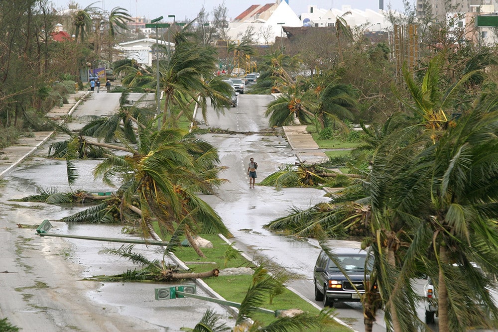 A general view of a principal hotel avenue after Hurricane Wilma hit the resort town of Cancun in Mexico's state of Quintana Roo, October 23, 2005. Mexico's famed Carribean resorts were knee-deep in water on Sunday after Hurricane Wilma roared past, uprooting trees, smashing homes and killing at least six people, as the storm set a new course [for Florida]. - PBEAHUNVWBG