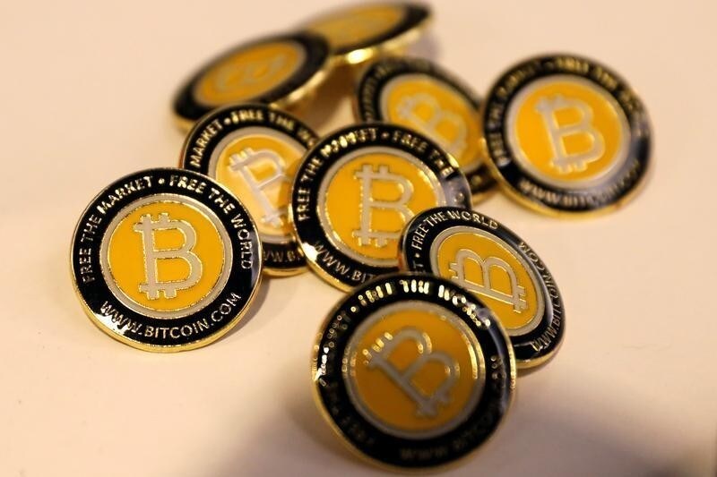 Bitcoin.com buttons are seen displayed on the floor of the Consensus 2018 blockchain technology conference in New York City, New York, U.S., May 16, 2018. REUTERS/Mike Segar - RC1B17B79620