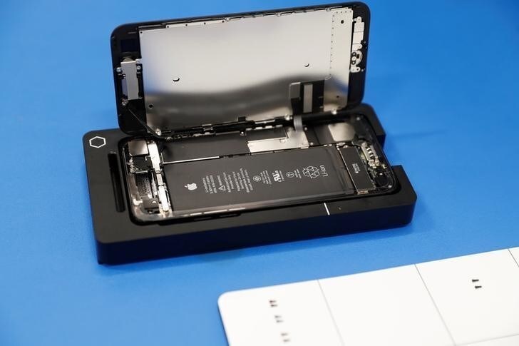 A partially disassembled Apple iPhone is seen on a repair fixture at Apple's display repair laboratory in Sunnyvale, California, U.S., May 19, 2017. REUTERS/Stephen Lam
