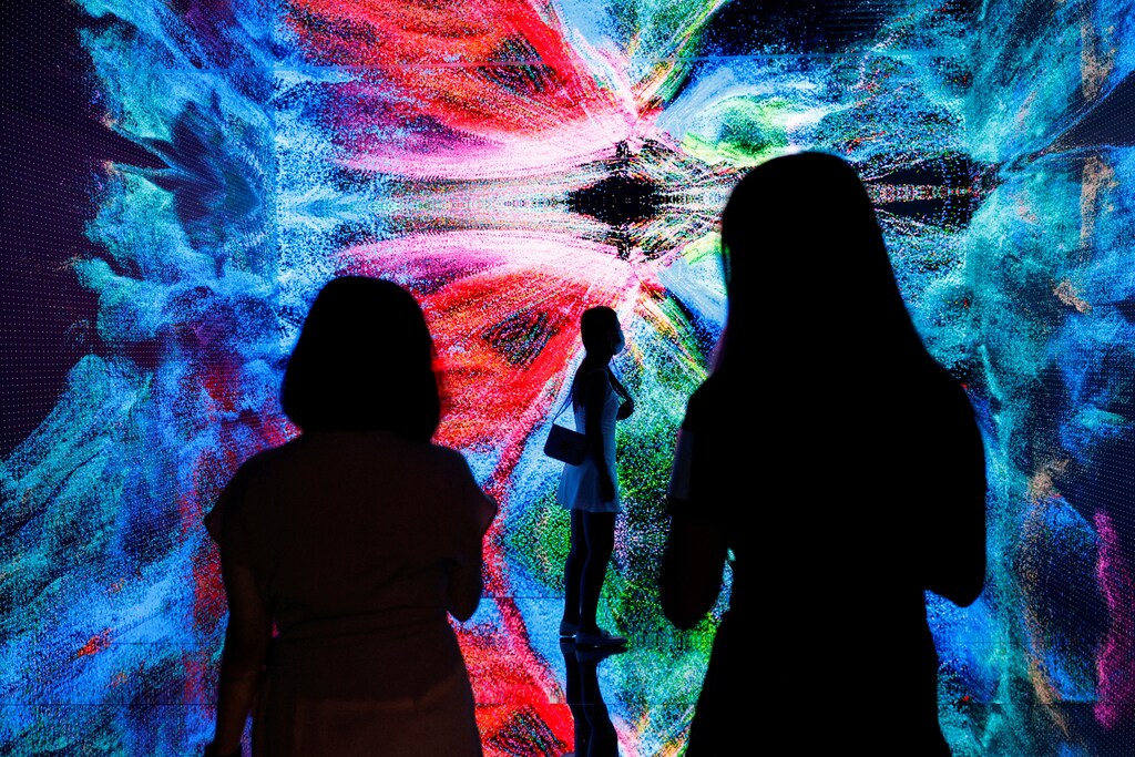 Visitors are pictured in front of an art installation which will be converted into NFT and auctioned online at Sotheby's, in Hong Kong.