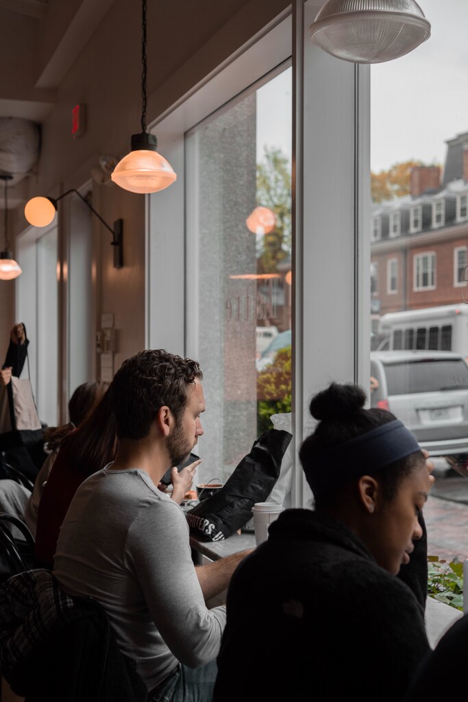 students in a cafe in Boston studying at harvard business school