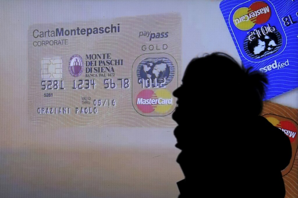 A Monte dei Paschi di Siena advertisement is seen on a screen in a bank window in downtown Milan, Italy, January 14, 2016. Monte dei Paschi di Siena's top shareholder, U.S.-based investment firm Fintech Advisory, is not selling down its 4.5 percent stake in the bank, a source close to Fintech told Reuters on Wednesday. REUTERS/Stefano Rellandini - RTX22G30