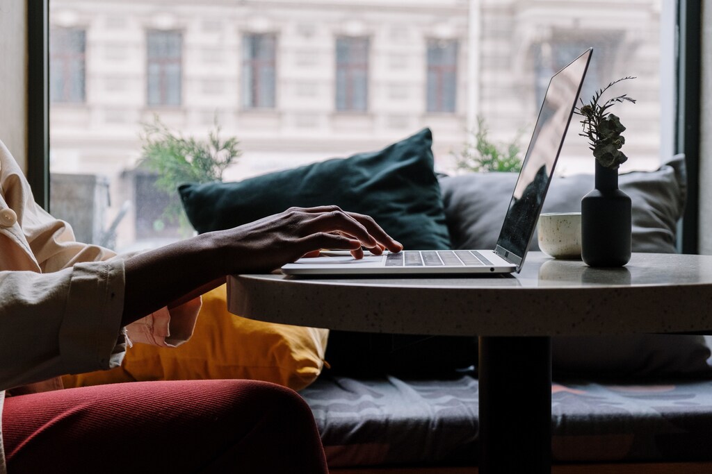 A person using a laptop at home