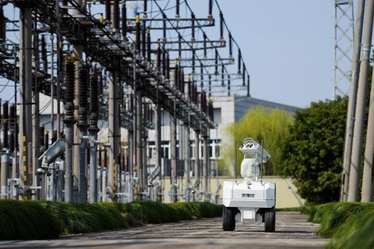 A robot inspects power equipment at an electrical substation of the State Grid Corporation of China in Jiaxing, Zhejiang province, China March 12, 2018. REUTERS/Stringer ATTENTION EDITORS - THIS IMAGE WAS PROVIDED BY A THIRD PARTY. CHINA OUT.