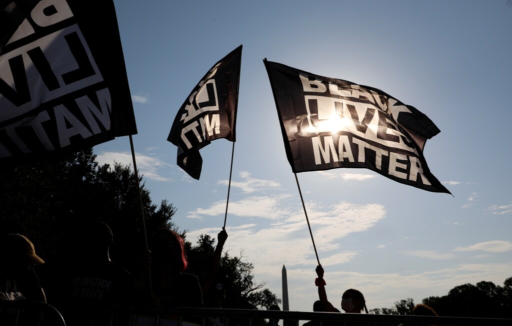Demonstrators with "Black Lives Matter" banners begin to gather at the Lincoln Memorial for the "Get Your Knee Off Our Necks" rally and March on Washington 2020 in support of racial justice in Washington, U.S., August 28, 2020. REUTERS/Tom Brenner - RC21NI9DH2L2