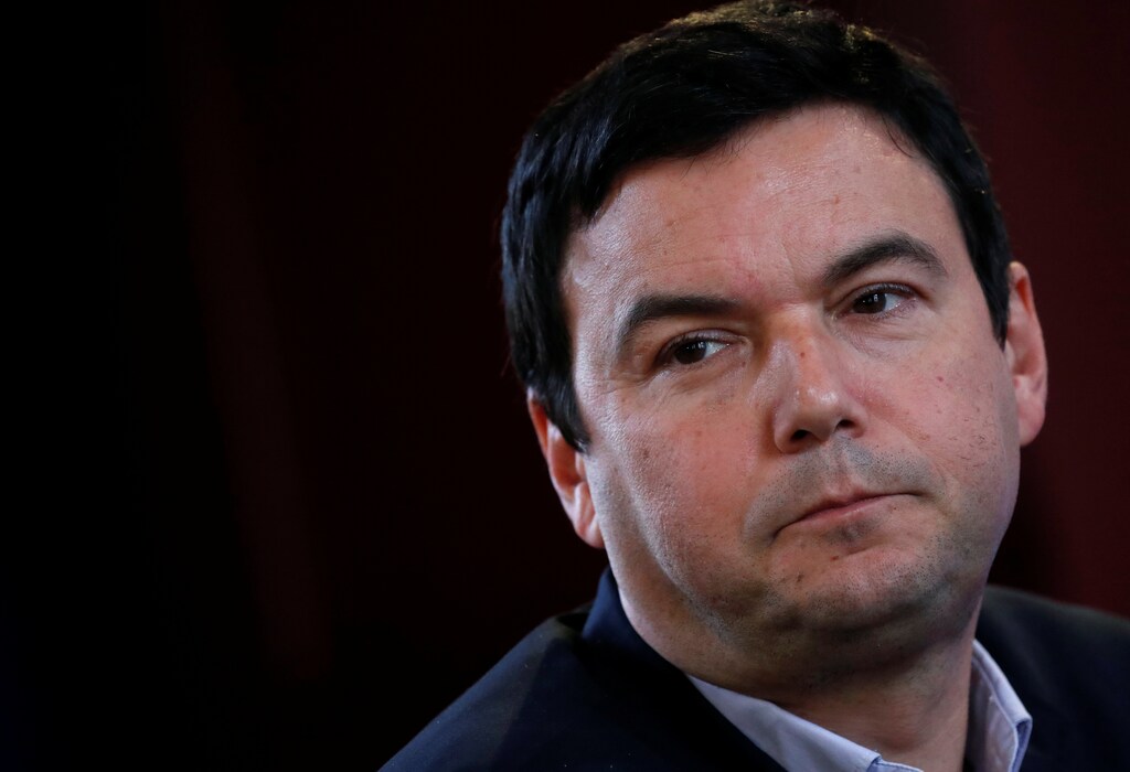 French economist and academic Thomas Piketty attends a news conference by French Socialist party 2017 presidential candidate Benoit Hamon (not seen) in Paris, France, March 10, 2017. REUTERS/Christian Hartmann - RC19D0016B00