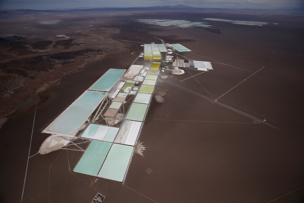 An aerial view of the brine pools and processing areas of the Rockwood lithium plant on the Atacama salt flat, the largest lithium deposit currently in production, in the Atacama desert of northern Chile January 10, 2013. Far from the soy and cattle that dominate its vast fertile pampas, Argentina harbors another valuable commodity that is rocketing in price and demand and luring newly welcomed foreign investors. Lithium, the so-called "white petroleum", drives much of the modern world. It forms a small but essentially irreplaceable component of rechargeable batteries, used in consumer devices like mobile phones and electric cars. It also has pharmaceutical and other applications. Picture taken January 10, 2013. REUTERS/Ivan Alvarado - RTSAHGU