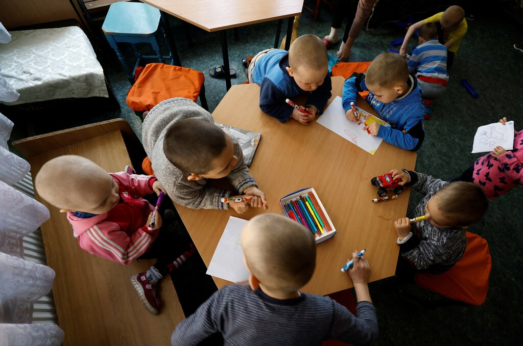 Children who were taken away from families struggling with alcoholism, drug addiction and domestic violence draw and play in a state shelter for children in Lviv, Ukraine March 25, 2022. Some of the children were evacuated to the relative safety of Lviv from another child care centre in the east amid the Russian invasion. Picture taken March 25, 2022. REUTERS/Zohra Bensemra