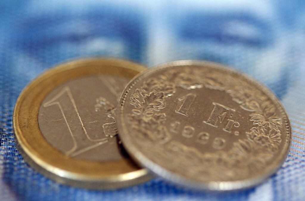 An one euro coin and an one Swiss franc coin are seen on a one hundred Swiss franc note, in this picture illustration taken in Zurich August 8, 2011. The safe-haven Swiss franc and the yen soared on Monday after Standard & Poor's cut the U.S. credit rating and on fears euro zone debt troubles could worsen into a global crisis despite efforts to contain it. The euro fell against the U.S. dollar, retracing early gains after European Central Bank purchases of Spanish and Italian debt did little to alleviate concern the region's debt crisis is moving into core countries. The euro hit a record low against the Swiss franc, falling as low as 1.0640 Swiss francs women business businesswoman businessman corporation corporate finance wall street stock exchange capitalism private ownership board c-suite CEOs CFOs corporation united states us america wall street change gender parity equality goldman sachs davos industry representation fair finance fiscal financial economics economies trading trade price money profit value men male female change changing 2020 future taxation tax wealth gross domestic product gdp politics democracy capitalism socialism fairness economics government govern administration system power voting votes elections electing faith trust electorate legislature house of commons house of lords congress senate house of representative prime minister government cabinet president executive legislative democrats republicans labour conservatives left wing right win us Australia united states new Zealand Switzerland EU European union Norway Finland Sweden united kingdom uk
