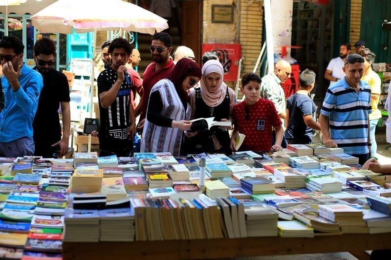 Iraqi women shop for books at Mutanabi Street in Baghdad, June 22, 2018. Picture taken June 22, 2018.