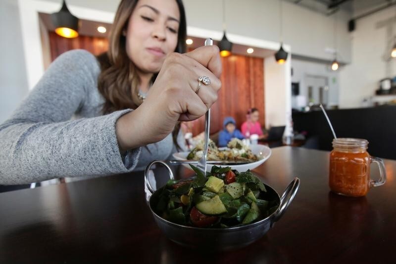 A customer eats a salad at Tasty Beet Juicy and Healthy Food restaurant in Ciudad Juarez, Mexico January 29, 2018.