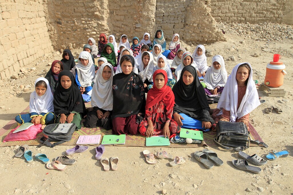 Teacher Mahajera Armani and her class of girls pose for a picture at their study open area, founded by Bangladesh Rural Advancement Committee (BRAC), outside Jalalabad city, Afghanistan September 19, 2015. Nearly three years after Taliban gunmen shot Pakistani schoolgirl Malala Yousafzai, the teenage activist last week urged world leaders gathered in New York to help millions more children go to school. World Teachers' Day falls on 5 October, a Unesco initiative highlighting the work of educators struggling to teach children amid intimidation in Pakistan, conflict in Syria or poverty in Vietnam. Even so, there have been some improvements: the number of children not attending primary school has plummeted to an estimated 57 million worldwide in 2015, the U.N. says, down from 100 million 15 years ago. Reuters photographers have documented learning around the world, from well-resourced schools to pupils crammed into corridors in the Philippines, on boats in Brazil or in crowded classrooms in Burundi.