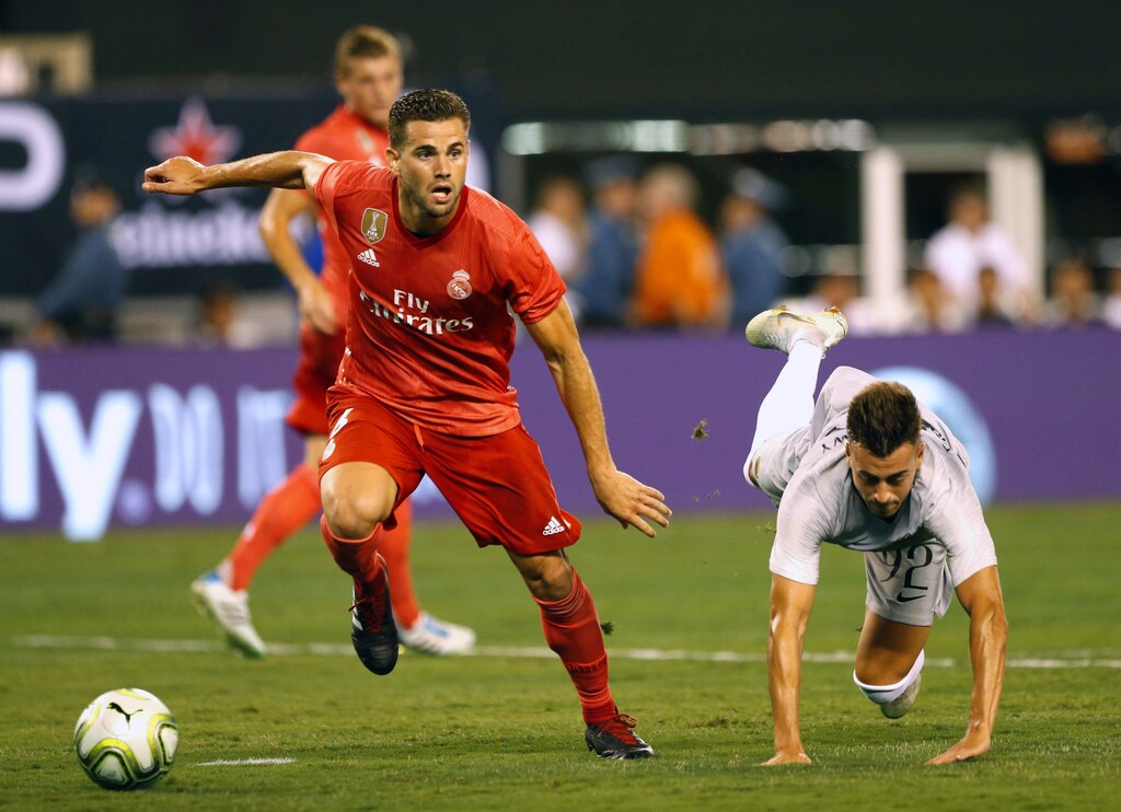 Aug 7, 2018; East Rutherford, NJ, USA; Real Madrid defender Nacho (6) and Roma forward Stephan El Shaarawy (92) battle for the ball during an International Champions Cup soccer match at MetLife Stadium. Mandatory Credit: Noah K. Murray-USA TODAY Sports - 11042176