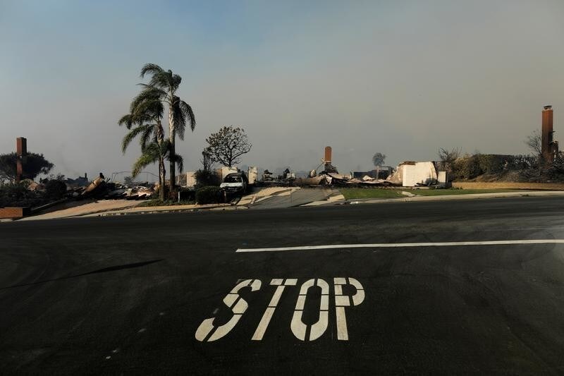 The remains of homes are seen, after they burned to the ground, during a wind-driven wildfire in Ventura, California, U.S., December 5, 2017. REUTERS/Mike Blake - RC16FBCC9E20