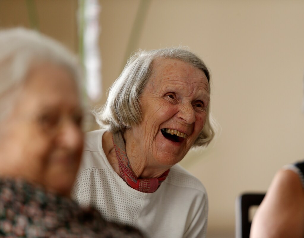 An elderly resident laughs during an activity session run by ACTive Age Malta at Hilltop Gardens retirement village in Naxxar, Malta, July 3, 2017. REUTERS/Darrin Zammit Lupi - RTS19KN0