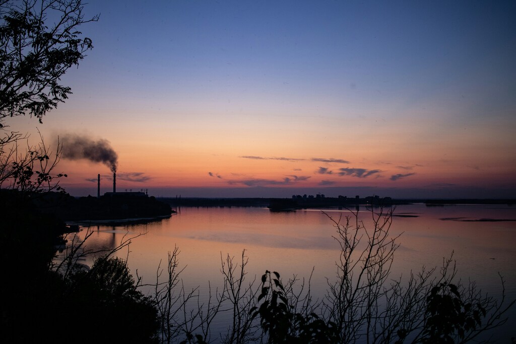 Evening, landscape, river and power plant with smoking pipes; Ukraine, energy security