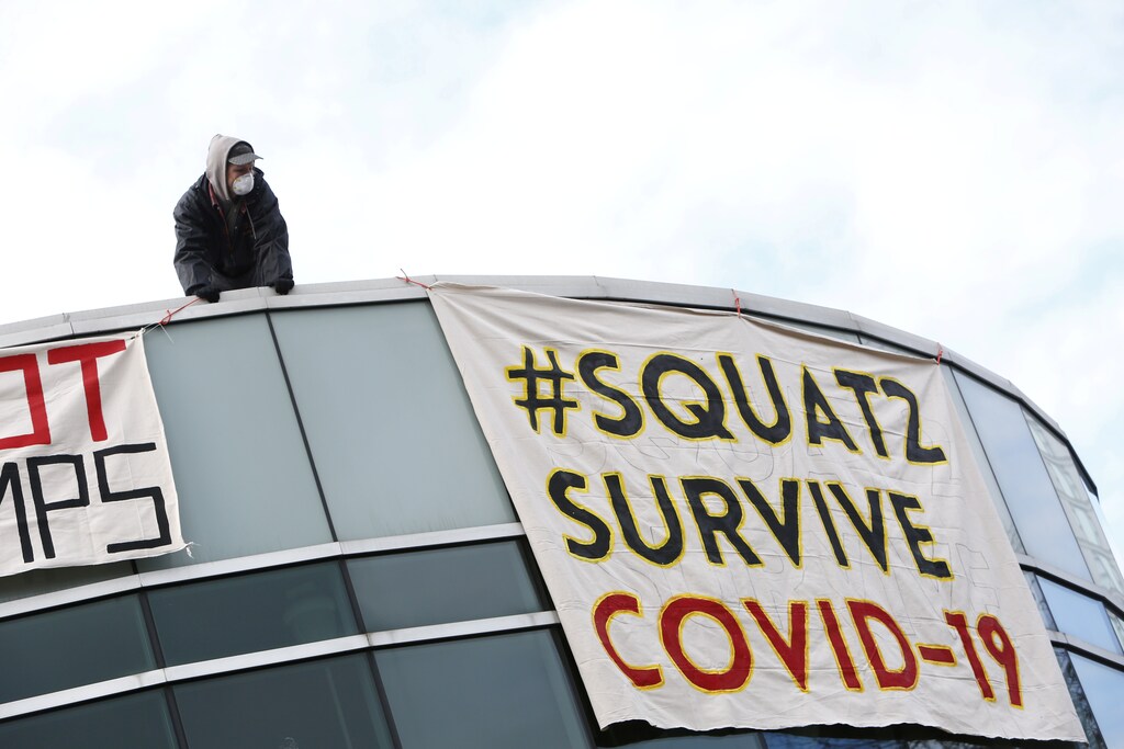 People squat in an empty community centre to protest what they describe as a lack of support for the homeless against the coronavirus disease (COVID-19) in Surrey, British Columbia, Canada April 1, 2020. REUTERS/Jesse Winter TPX IMAGES OF THE DAY - RC20WF900YOX
