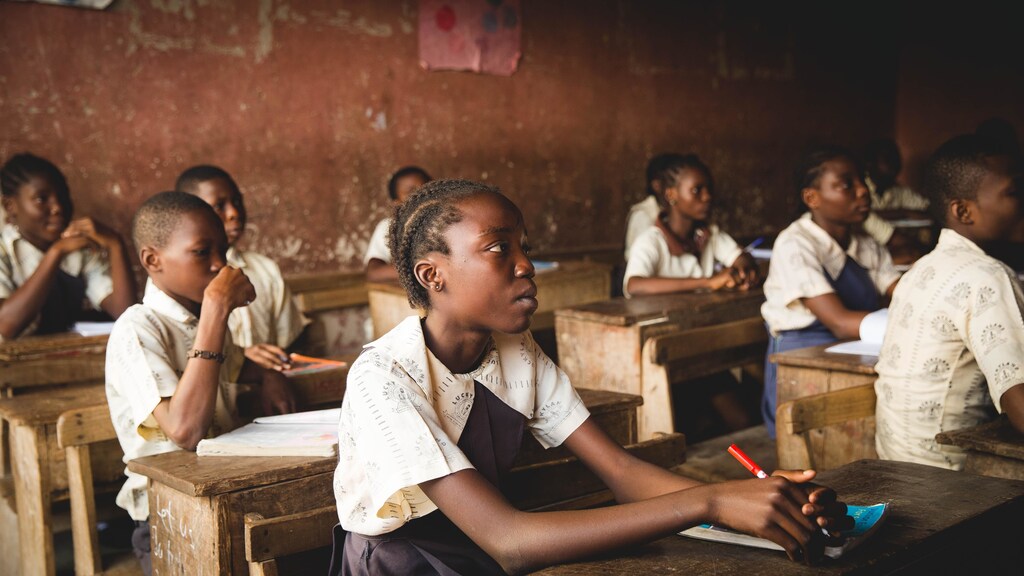 learning poverty: Children at school sitting and learning.