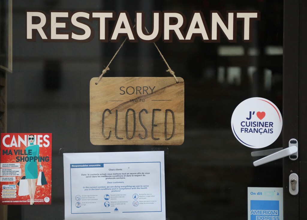 A sign reading "Sorry, we are closed" is seen on a closed restaurant in Cannes as the French government keeps bars and restaurants closed as part of COVID-19 restrictions measures to fight the coronavirus disease outbreak in France, January 11, 2021. REUTERS/Eric Gaillard - RC2S5L9ZJ0J1