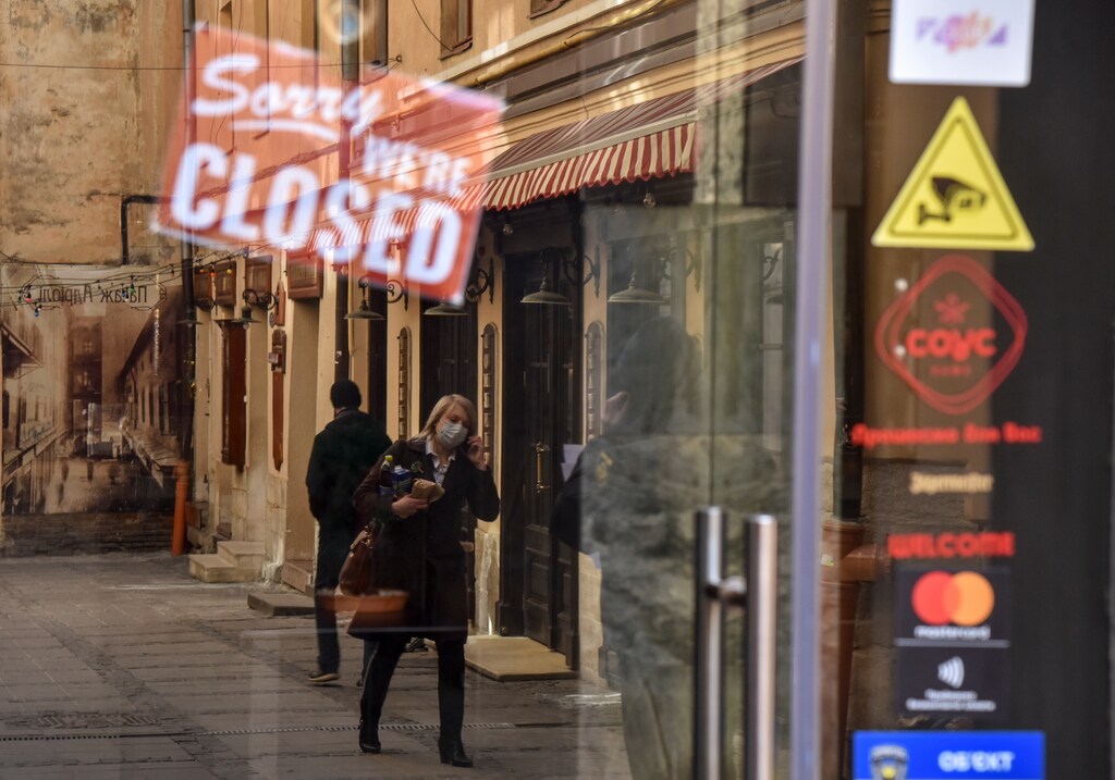 A woman wearing protective mask is reflected in a window of a closed shop, amid coronavirus (COVID-19) concerns, in Lviv, Ukraine March 16, 2020. women business businesswoman businessman corporation corporate finance wall street stock exchange capitalism private ownership board c-suite CEOs CFOs corporation united states us america wall street change gender parity equality goldman sachs davos industry representation fair finance fiscal financial economics economies trading trade price money profit value men male female change changing 2020 future taxation tax wealth gross domestic product gdp environment renewable solar energy change transition friendly environment carbon footprint carbon emissions reduction change natural climate change global warming air pollution clean energy power renewables plastic plastics Coronavirus china virus health healthcare who world health organization disease deaths pandemic epidemic worries concerns Health virus contagious contagion viruses diseases disease lab laboratory doctor health dr nurse medical medicine drugs vaccines vaccinations inoculations technology testing test medicinal biotechnology biotech biology chemistry physics microscope research influenza flu cold common cold bug risk symptomes respiratory china iran italy europe asia america south america north washing hands wash hands coughs sneezes spread spreading precaution precautions health warning covid 19 cov SARS 2019ncov wuhan sarscow wuhanpneumonia pneumonia outbreak patients unhealthy fatality mortality elderly old elder age serious death deathly deadly