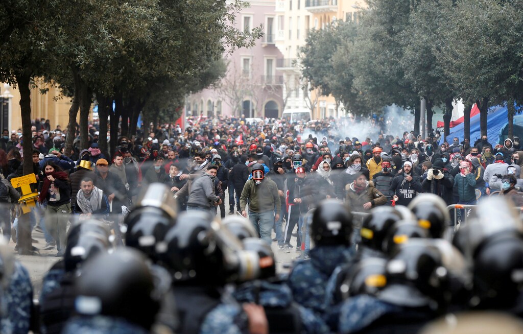 Demonstrators take part in a protest seeking to prevent MPs and government officials from reaching the parliament for a vote of confidence, in Beirut, Lebanon February 11, 2020. REUTERS//Mohamed Azakir TPX IMAGES OF THE DAY - RC2DYE934W3Q