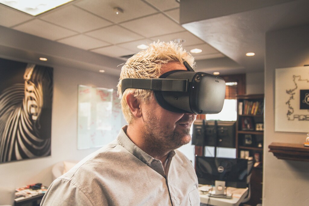 Metaverse has a potential to play a broader role in society through its ability to open our horizons; Pictured here is a man wearing a VR headset in an indoor setting