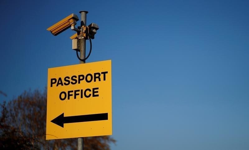 A sign directing people towards the passport office is seen in Liverpool, Britain, November 15, 2018. REUTERS/Phil Noble - RC12C2414460