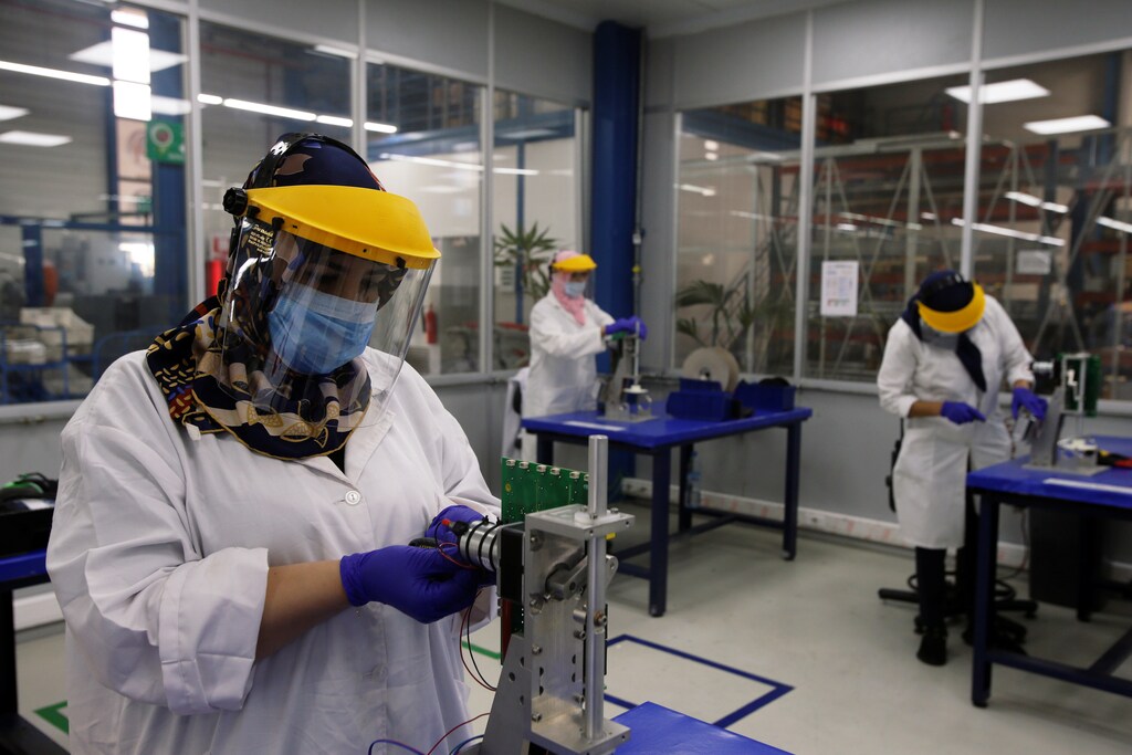 Employees work on a Moroccan ventilator at a factory in Casablanca following an outbreak of the coronavirus disease (COVID-19), in Casablanca, Morocco April 10, 2020. REUTERS/Youssef Boudlal - RC2R1G9PHAI0
