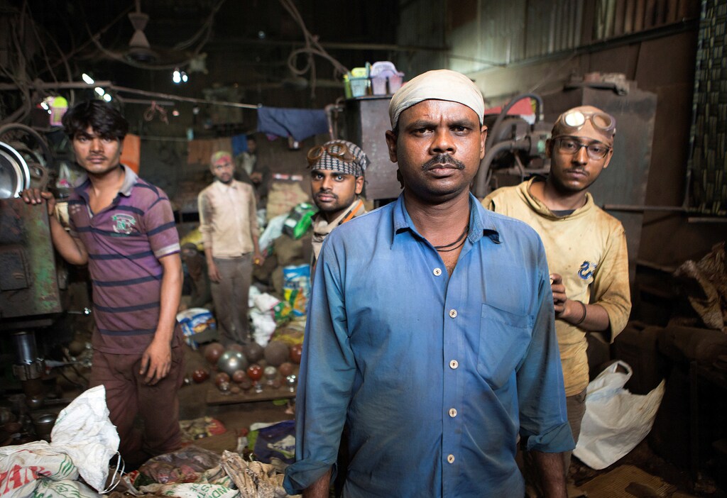 The foreman and skilled laborers of a factory making casted metal doorknobs in Dharavi slum, Mumbai, on September 24, 2016.