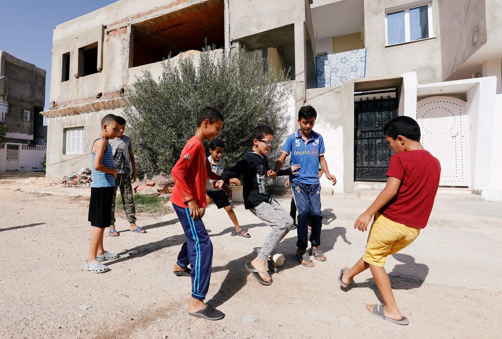 Boys play near the house of Fakher Hmidi, a young man who still unaccounted for after last week's capsizing off the Italian island of Lampedusa, in Thina district of Sfax, Tunisia October 15, 2019. Picture taken October 15, 2019. REUTERS/Zoubeir Souissi - RC1F5E3D2A50