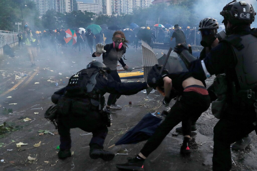 Riot police clash with anti-government protesters during a demonstration in Sha Tin district, on China's National Day in Hong Kong, China October 1, 2019